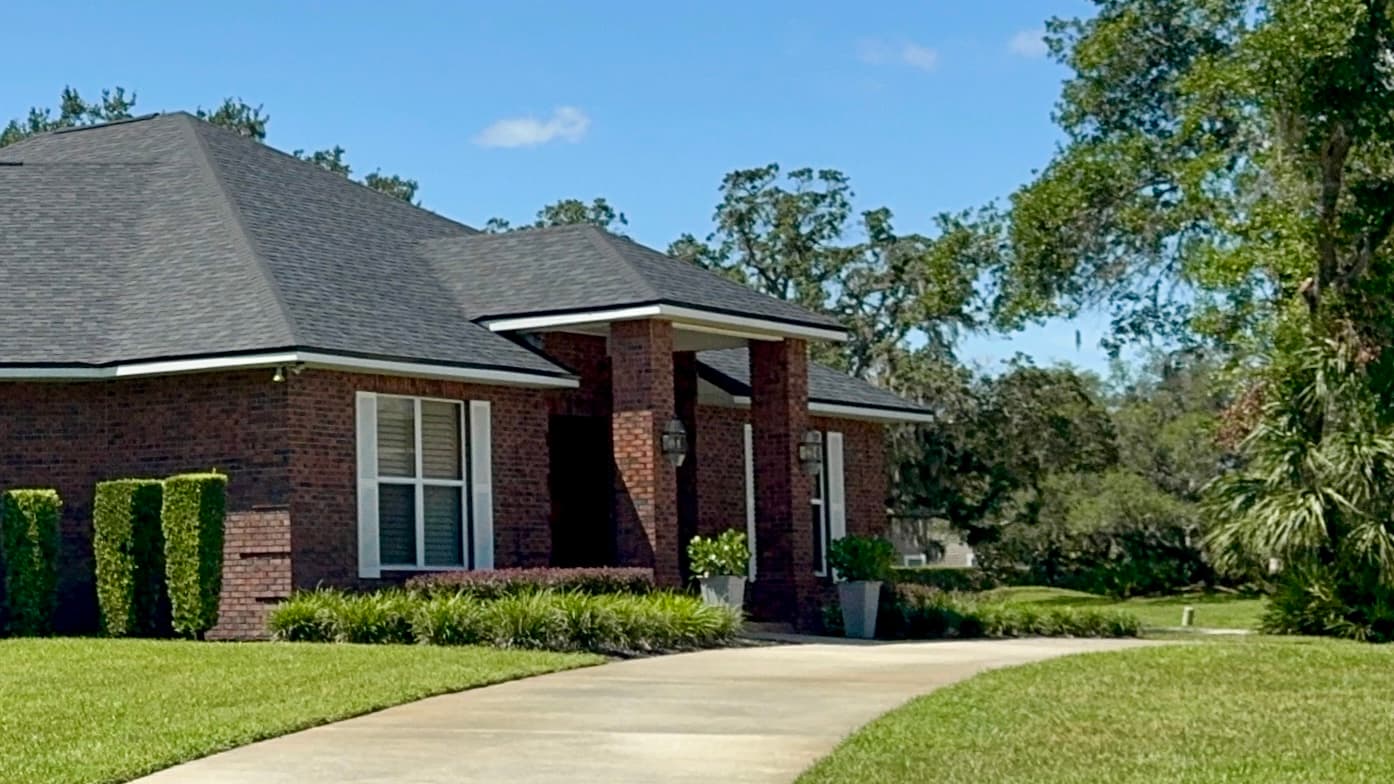 Bloomingdale brick home with columned entry in Valrico FL representing summer 2026 real estate market recap and Q4 2026 outlook for buyers and sellers